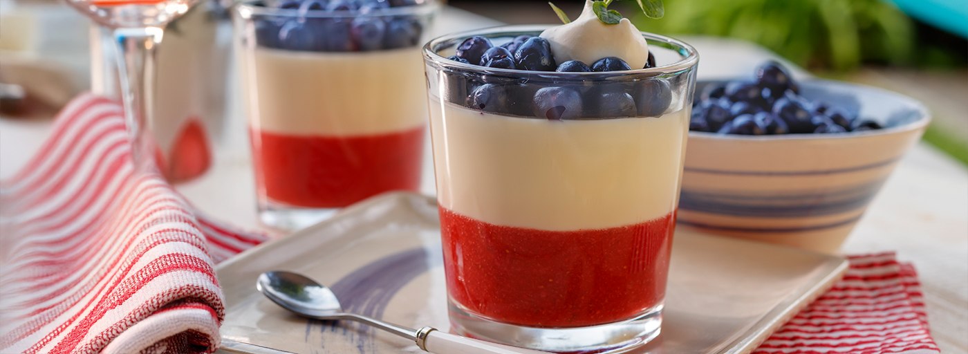view patriotic layered dessert on a spring tablescape with flowers, image by Gourmet Food Store