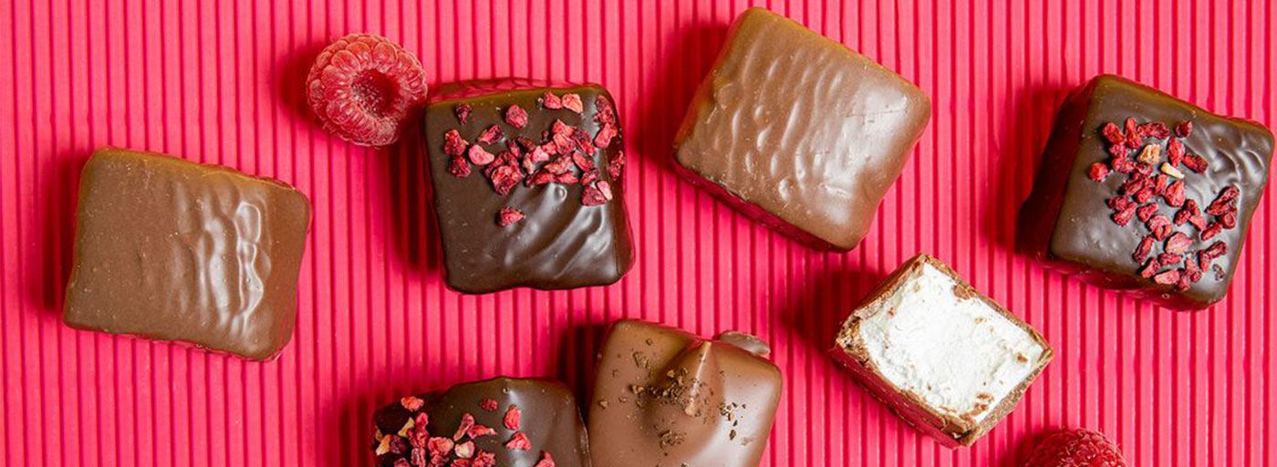 Belgian chocolates on red background