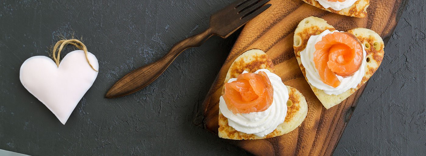 smoked salmon on heart shaped blini