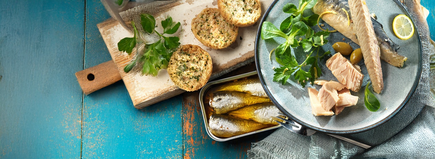 anchovies plated on a blue board